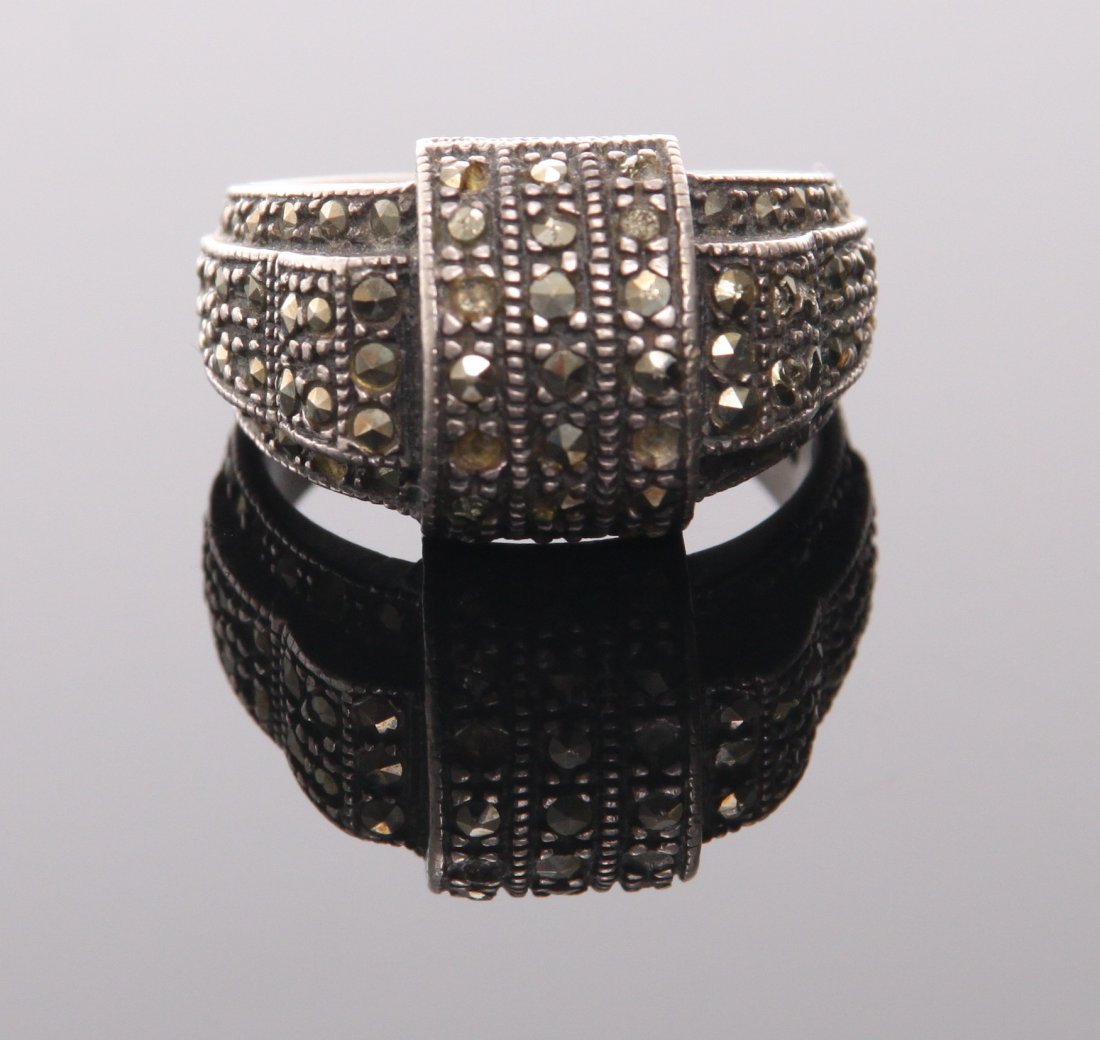 Sterling silver ring with marcasite stones. SIZE: see: Sterling silver ring with marcasite stones. SIZE: see attached ruler photo. Photos are part of the description representing the condition report and can be used for authentication prior to the sale da