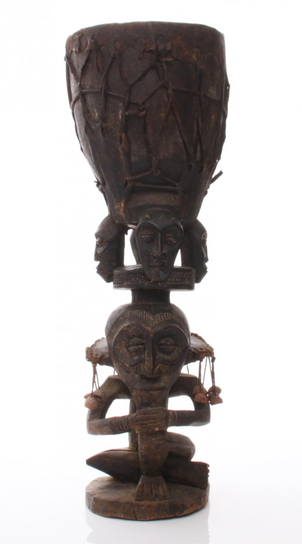 Antique wood carved African Yoruba tribal drum: Antique wood carved African Yoruba tribal drum. Estimated more than 100 yrs old. African art is a term typically used for the art of Sub-Saharan Africa. A few of the most popular traditional African a