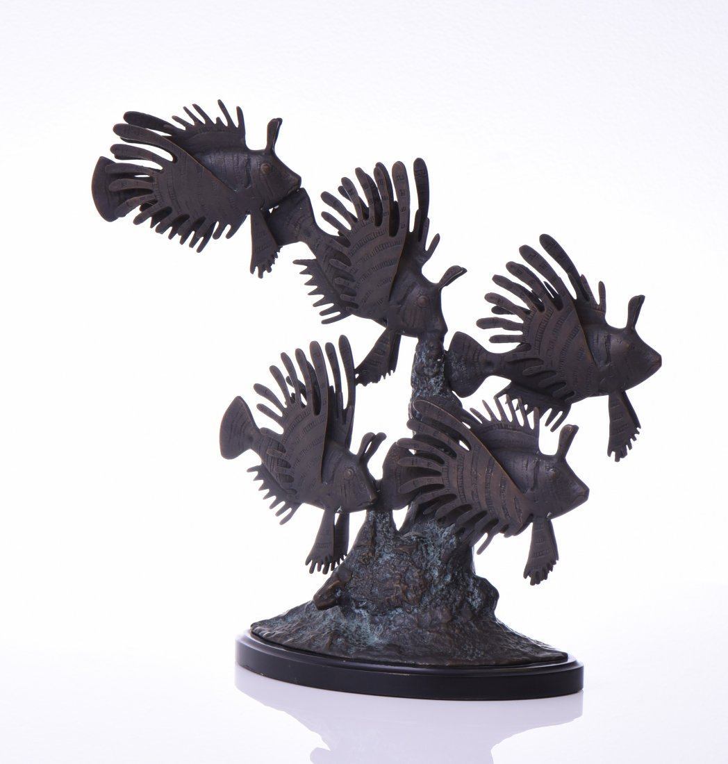 Bronze Sculpture Of A School Of Lion Fish Swim: Bronze Sculpture Of A School Of Lion Fish Swimming Past A Coral Reef, Mounted On A Black Marble Base. Estimated more than 50 yrs old. American art is visual art and started with colonial art on the Ea