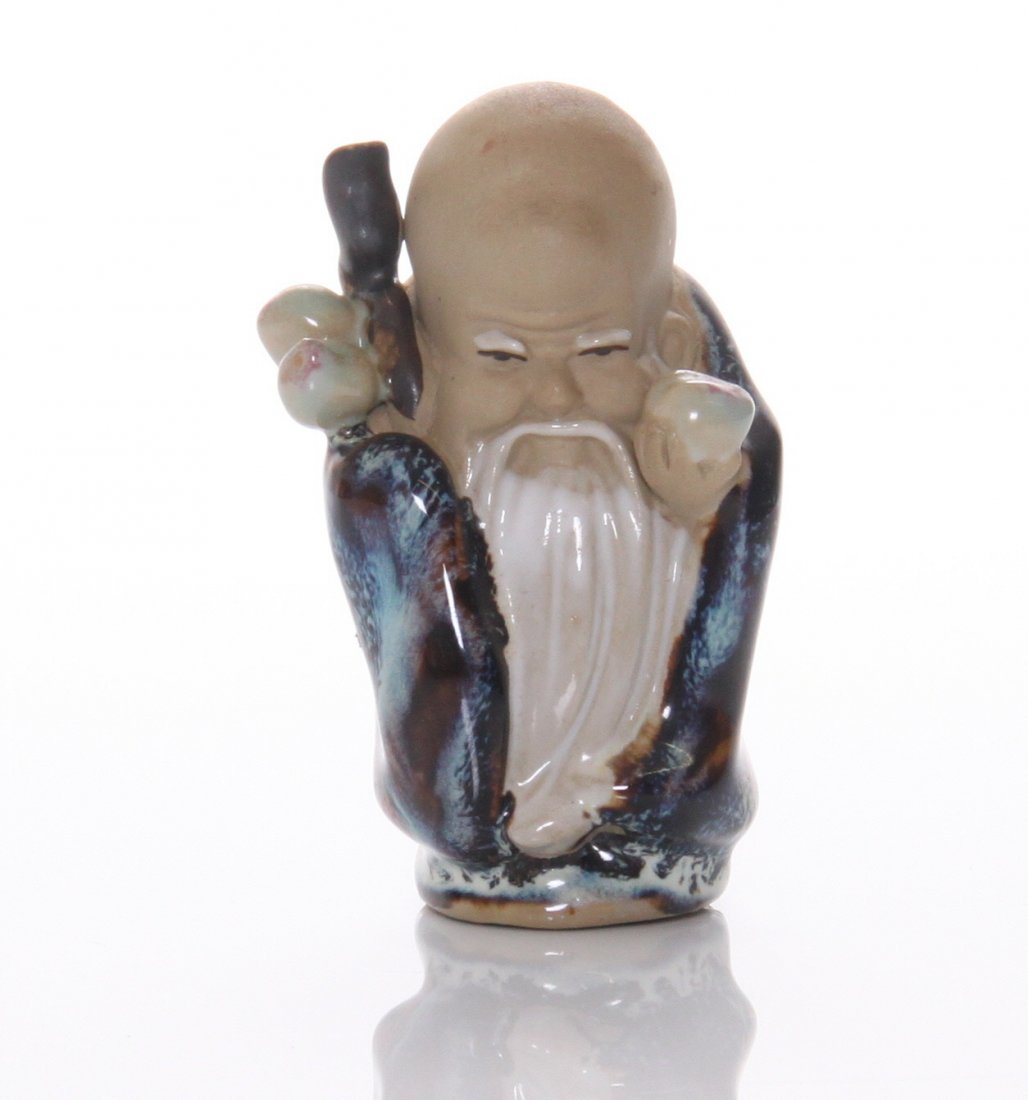 Chinese mud man figurine of the longevity God: Chinese mud man figurine of the longevity God Shou Xing, holding a wood staff and peaches. Estimated more than 50 yrs old. Chinese art is visual art that, whether ancient or modern. Early "stone age a