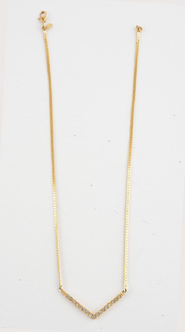 MONET: Gilded metal and little brilliants necklace, signed "Monet". Weight: 4.7g.