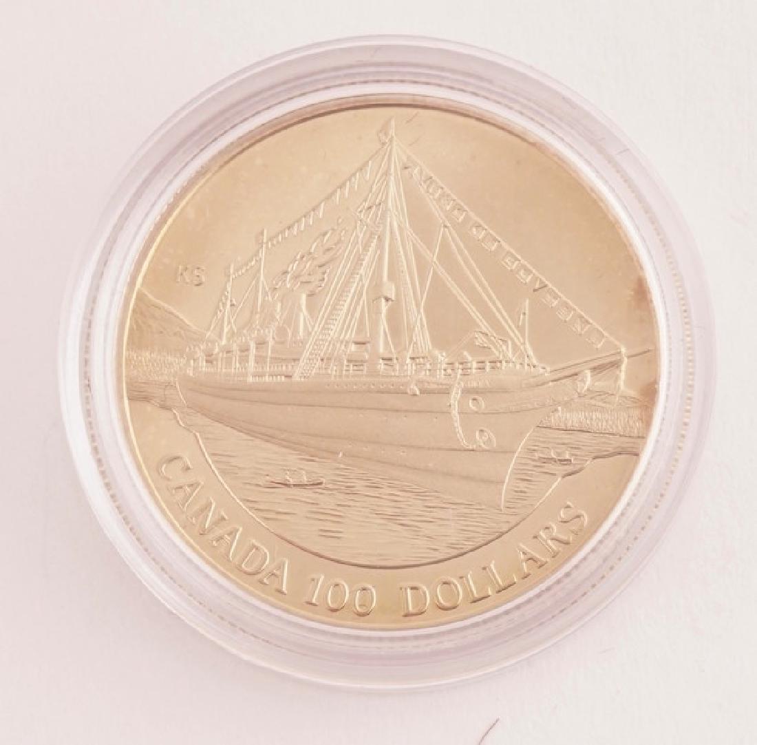 CANADIAN 100$ - 14K GOLD AND SILVER - 1991: Canadian 14K gold and silver (58.33% gold and 41.67 silver) 100$ coin from 1991, the obverse with the face Elizabeth II, the reverse with the design of artist Karsten Smith portraying the arrival of t