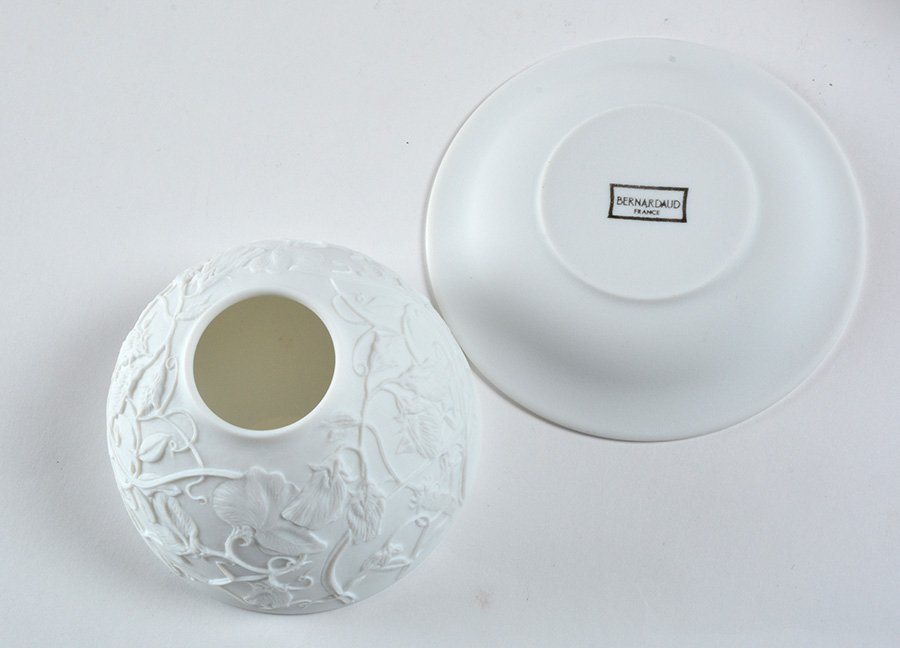 BERNARDAUD - LES LITHOPHANIES: Series of two unglazed porcelain photophores, model "Sweet peas".Signed "Bernardaud France" below.Total H.: 7.5cm - 3"Also included a set of spare candles.