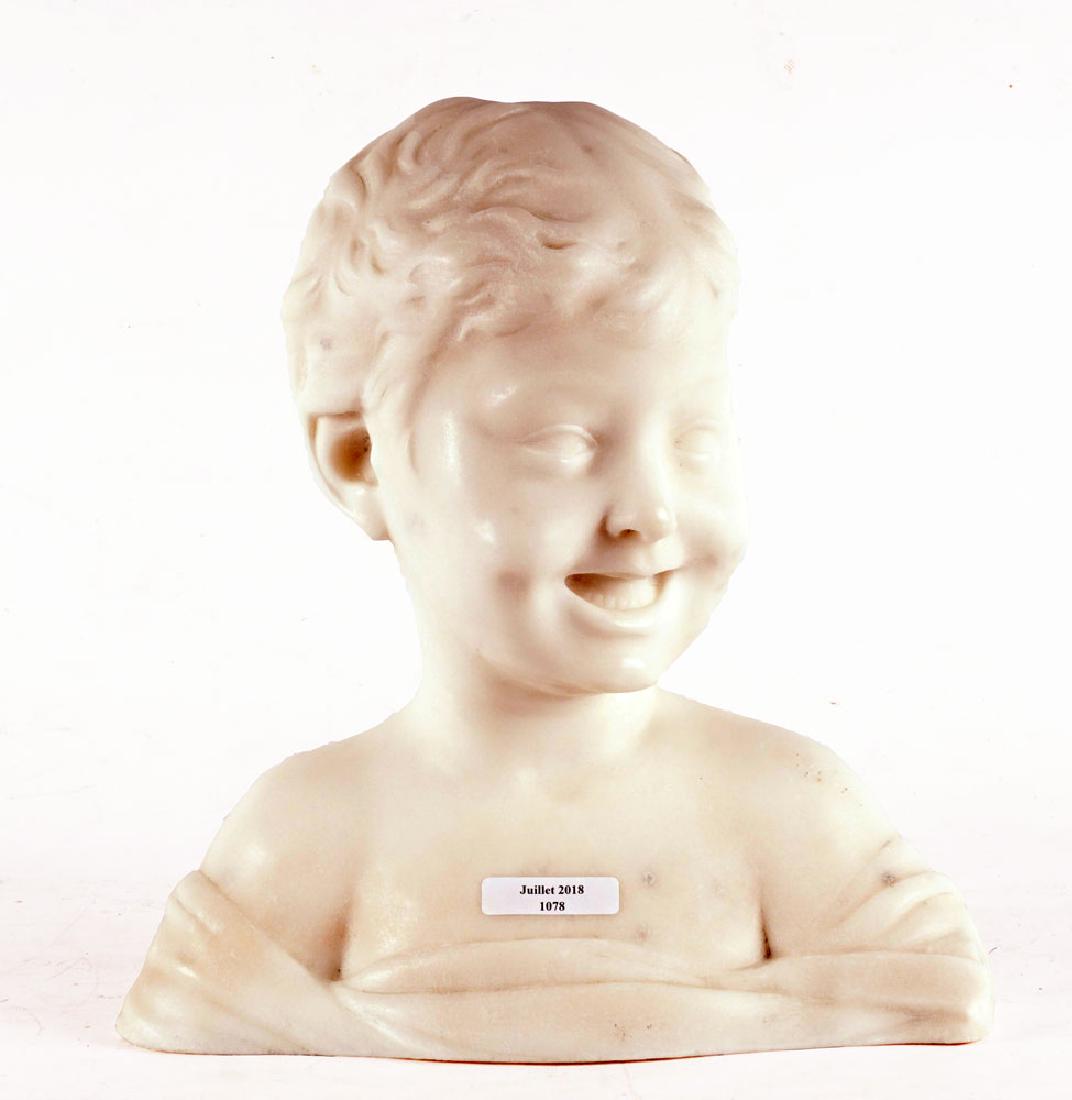 ALABASTER: Alabaster bust of a young smiling boy. H: 31cm - 12.25" L: 30cm - 11.75" P: 13cm - 5"