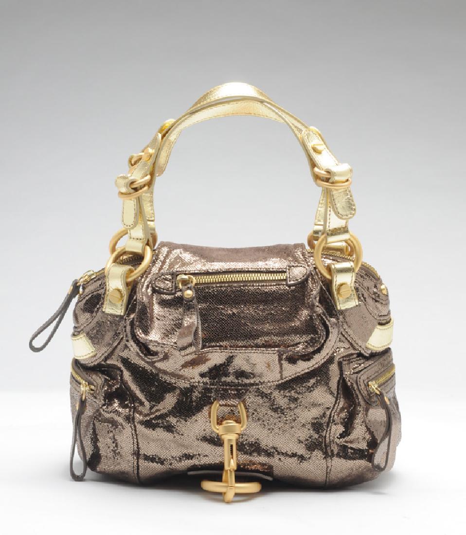 HUGO BOSS: Gold tone evening bag. With dust bag.