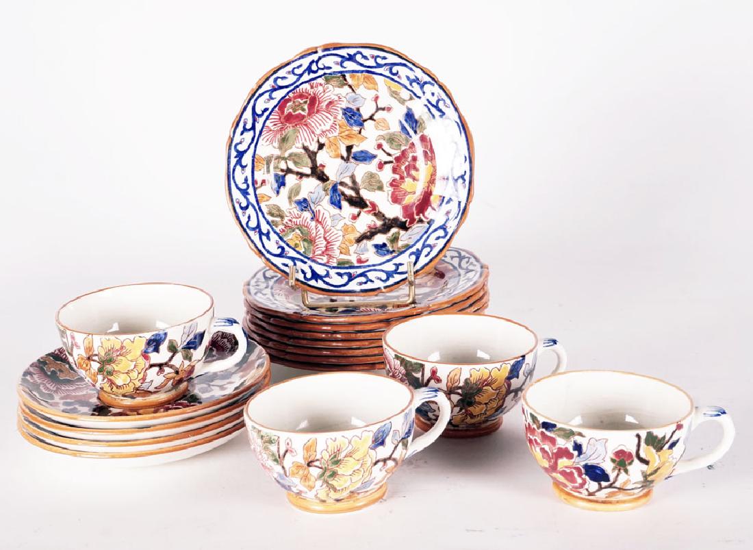GIEN - 20th c., France: GIEN - 20th c., France Set of tea set with polychrome Indian floral motifs including: - 4 tea cups and their saucers - 8 small dessert plates D.: 17.5 - 6.5"