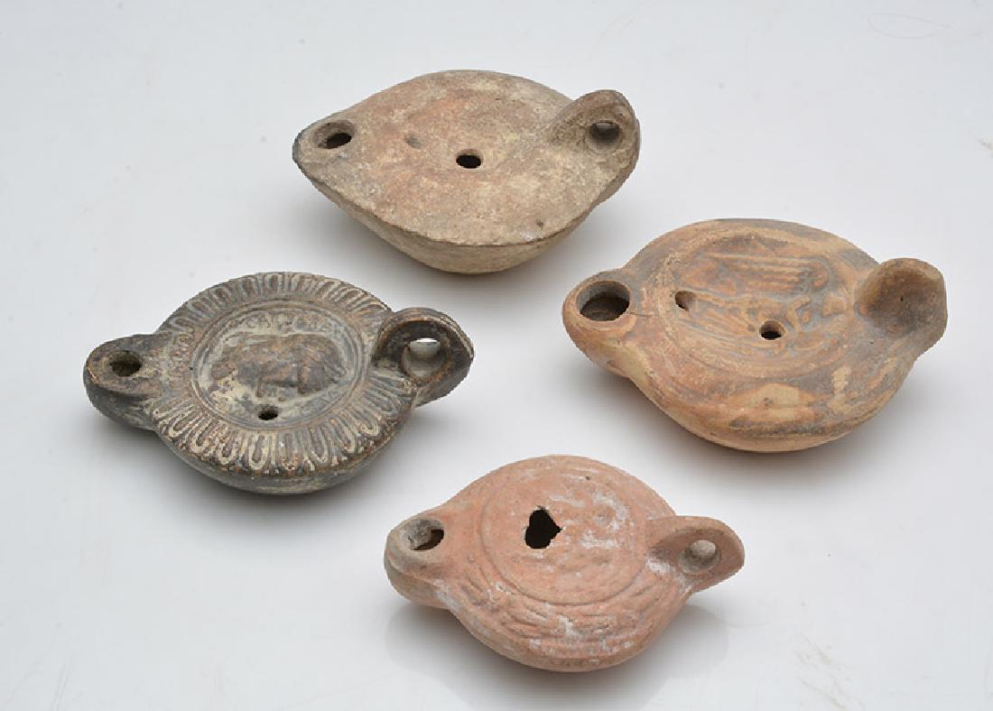 Group of 4 Roman Terra cotta Oil Lamps. circa 2nd-4th (1 of 1)