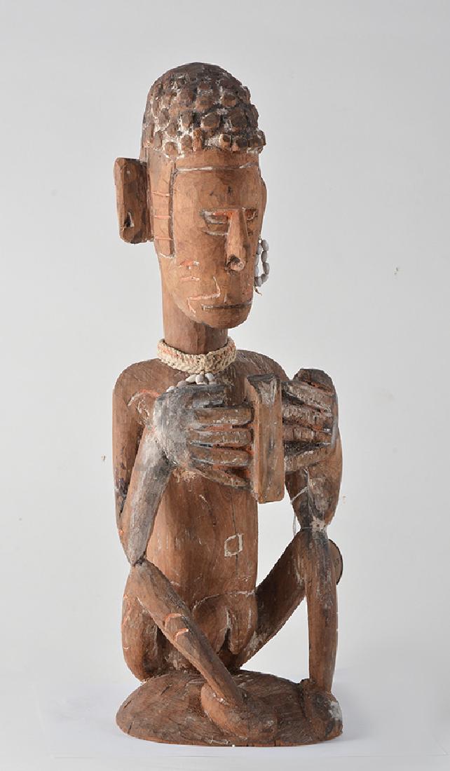 INDONESIA: Wooden and ornements Irian Jaya sculpture from Indonesia. H.: 49cm - 19.25"