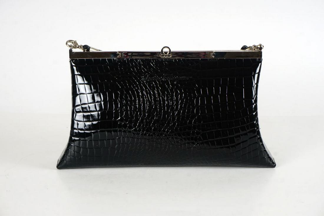 SALVATORE FERRAGAMO: SALVATORE FERRAGAMO POUCHBlack patent leather snakeskin style clutch, silver metal clasp and hardware, exterior zip pocket.Removable non-adjustable leather handle. 30x17cm French: POCHETTE SALVATORE