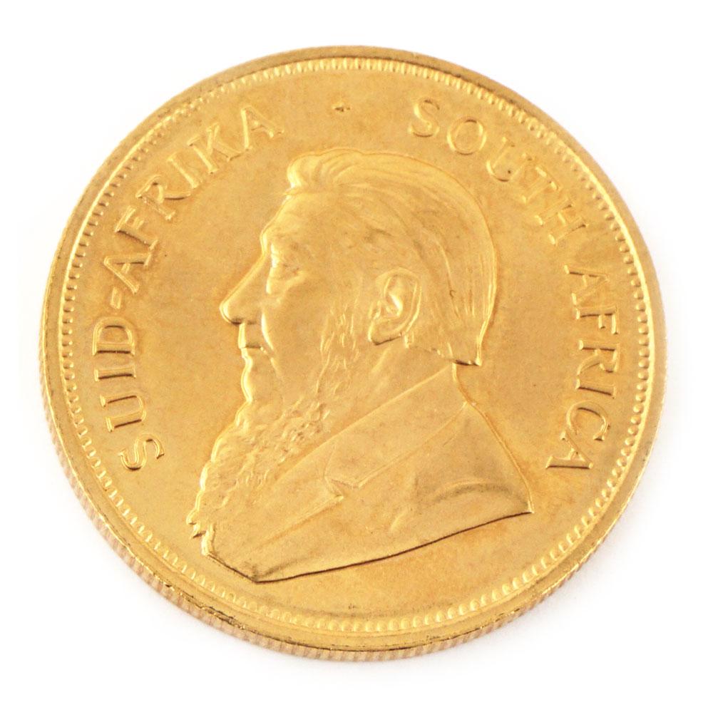 Une monnaie en or Krugerrand / One Kruggerand fyngood: Description française Une monnaie en or Krugerrand 1982 "Fyngoud 10z Fine Gold", 34g préservée dans un étui en plastique English Description One Kruggerand fyngood Gold coin from South Africa, 19