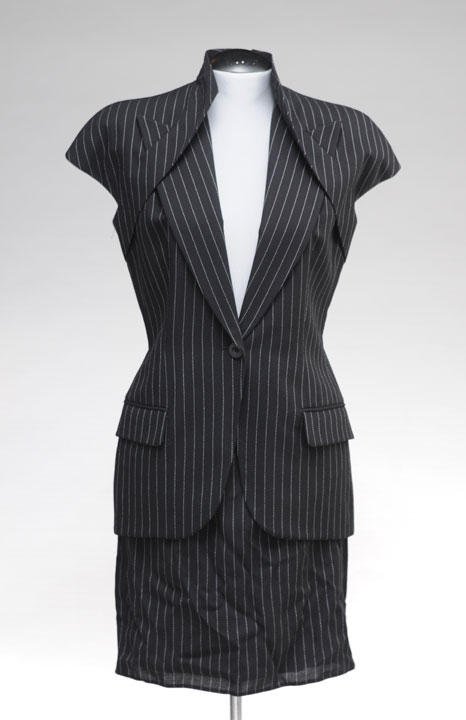 GIVENCHY: GIVENCHY Black with white stripes skirtsuit, graphics tailored collar, short sleeves, a button closure, two flap pockets. Straight skirt with zip back. Size.38.