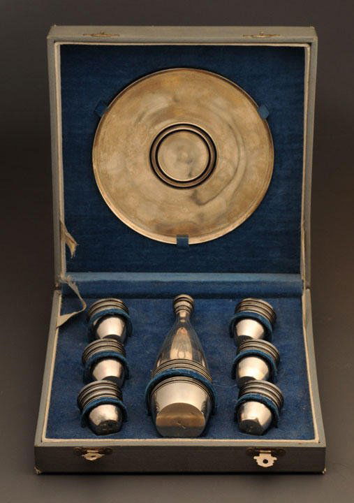 RAKVERE / WESENBERG Vodka silver tea set comprised: RAKVERE / WESENBERG Vodka silver tea set comprised of a tray, a bottle and six cups, in its original case. City's Hallmark on the bottoms: Rakvere / Wesenberg, Estonia. Weight: 381.5 gr.