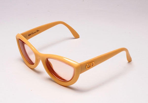 CHRISTIAN DIOR: Pair of beige sunglasses, CD monogrammed branches, in their original case. Prescription lenses.