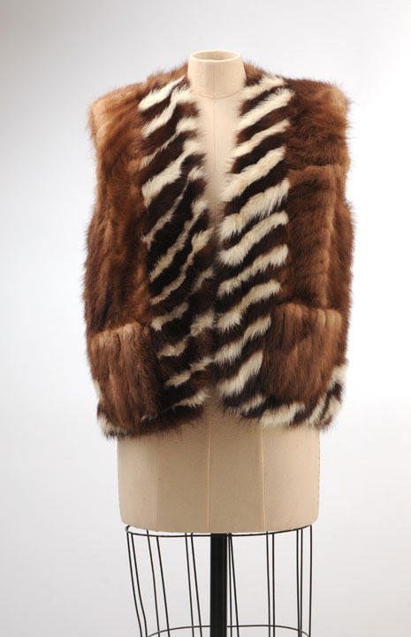 MINK: Sleeveless short mink vest, two pockets. Small to medium size.
