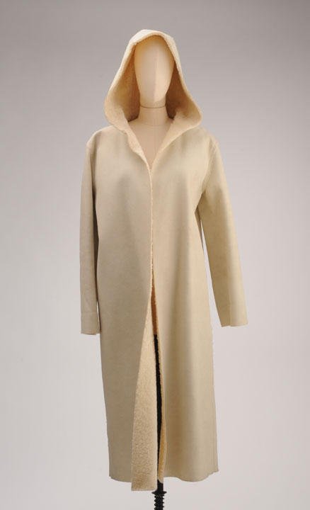 DKNY: White synthetic leather overcoat, synthetic white wool lining. Size M.