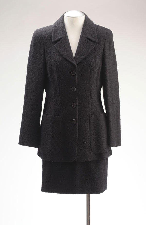 MAX MARA: Black woolen skirt suit. The vest with tailored collar, single breasted, 2 stitched patch pockets, straight skirt. Size 38.