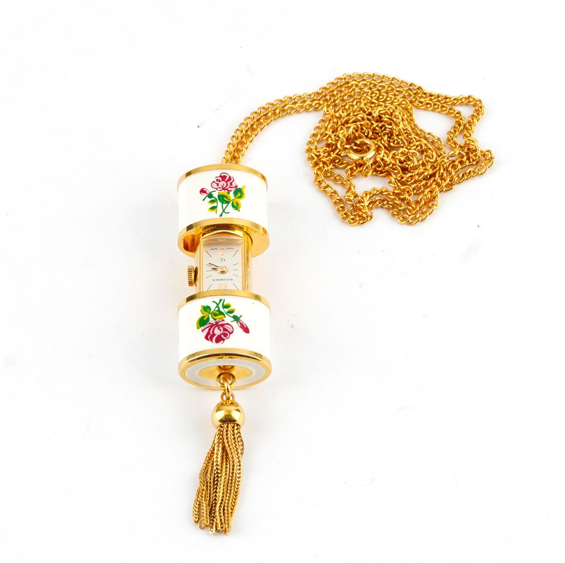 BUCHERER: Description française: BUCHERER Ancienne montre - pendentif Bucherer en émail blanc et décor flotal, cadran argenté , de 13 x 8 mm environ, mouvement quartz. Dimensions: 3.2 x 1.4