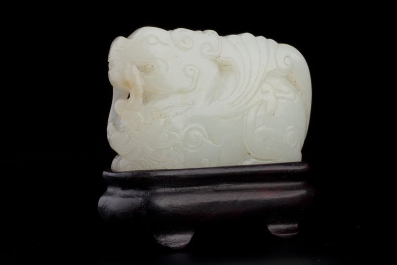 MUTTON FAT JADE CHIMERA - Westmount | US Airforce: WESTMOUNT COLLECTOR OF JADE AND SNUFF BOTTLES (LOTS 1004-1006, 1008, 1010-1013, 1015-1017, 1019-1027, 1029-1030, 1032 and 1034-1038) A FINE AND ANTIQUE CARVED WHITE MUTTON FAT JADE FIGURE OF A CROUCHI