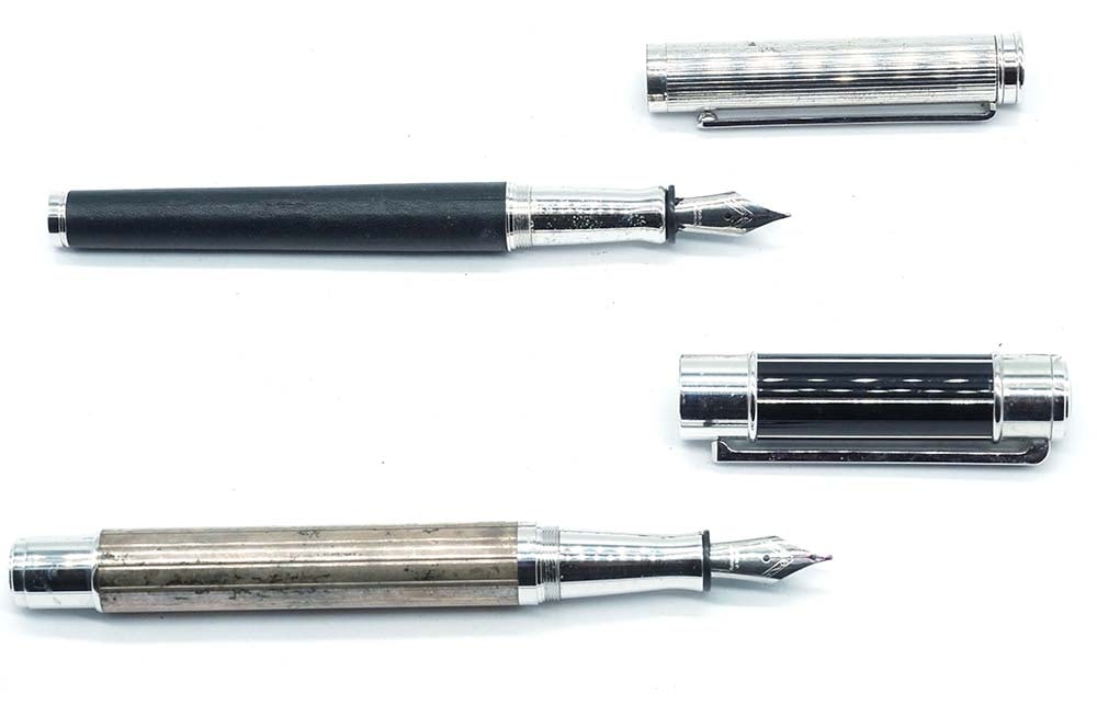 ROLLS ROYCE: Description française: ROLLS ROYCE Ensemble de 2 stylos à plume Rolls Royce, design strié, corps en argent sterling et en cuir noir. À cartouches. Sans boîte. English