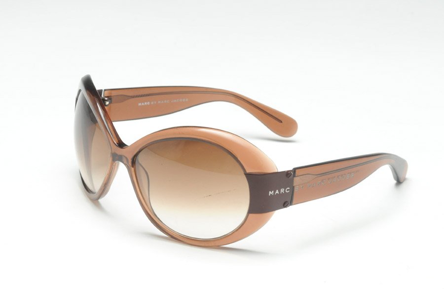 MARC BY MARC JACOBS: Brown sunglasses.