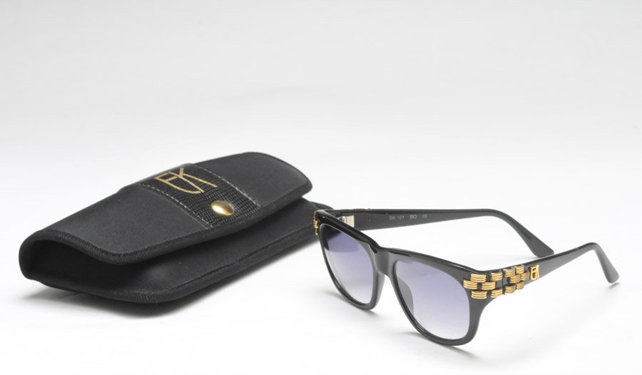 EMMANUELLE KHANH - PARIS: Black sunglasses, the branches decorated with gold tone mesh. With case.