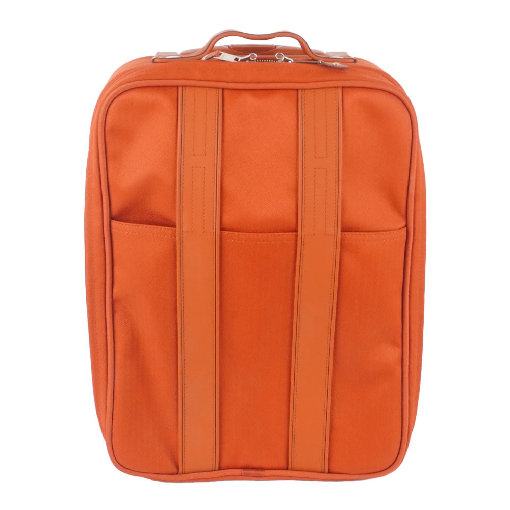HERMÈS: Description française: HERMÈS Valise de cabine souple Hermès de la ligne Acapulco, en toile orange et bandes verticales "H"en cuir, plusieurs pochettes intériueres, fermeture
