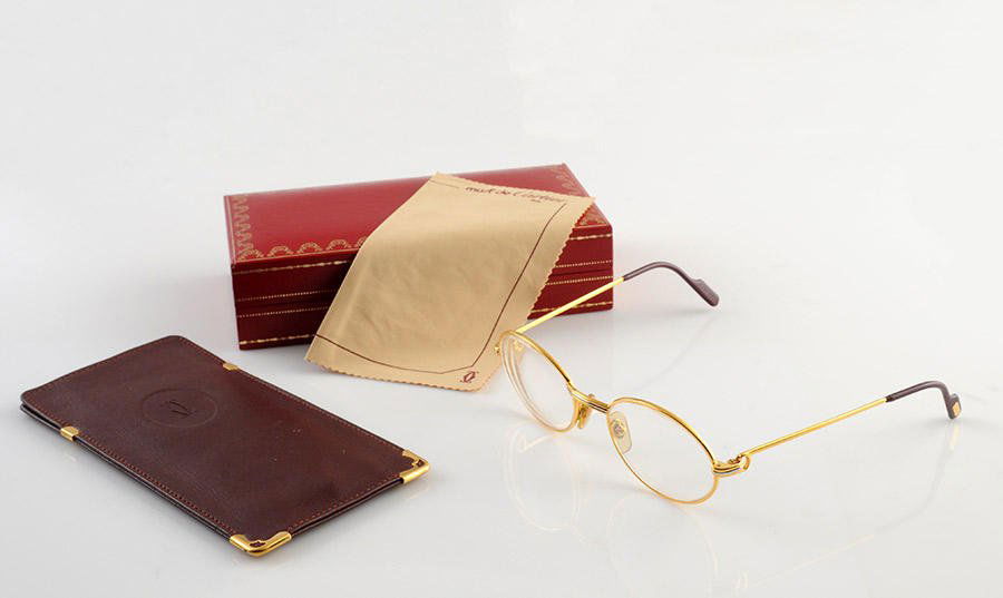 MUST DE CARTIER - MADE IN FRANCE: Goldplated metal glasses, the branches are adorned with the "C". With original box, envelope and documents.