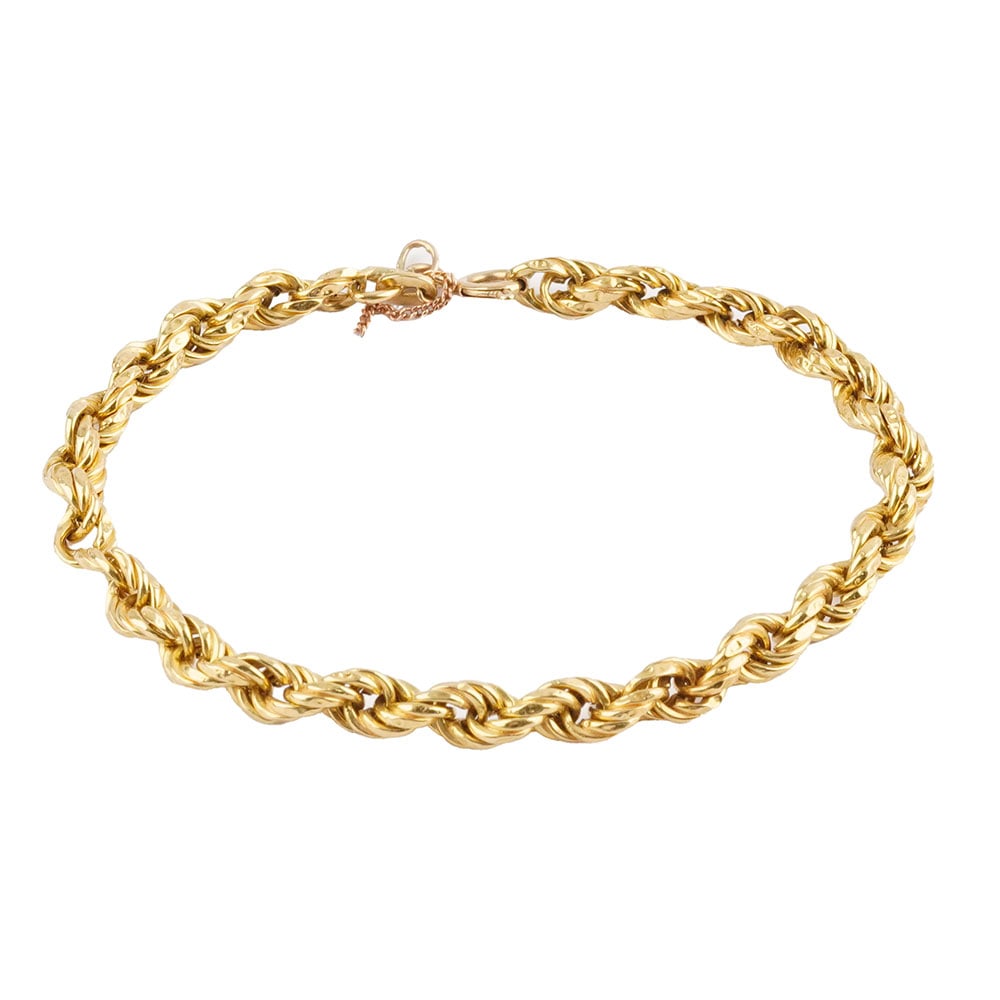 OR 18K /18K GOLD: Description française: OR 18K /18K GOLD Bracelet en or jaune 18K à maille torsadée. Poids brut: 5.3 g Longueur: 19 cm - 7.5" Un anneau en métal. English Description: 18K GOLD 18K