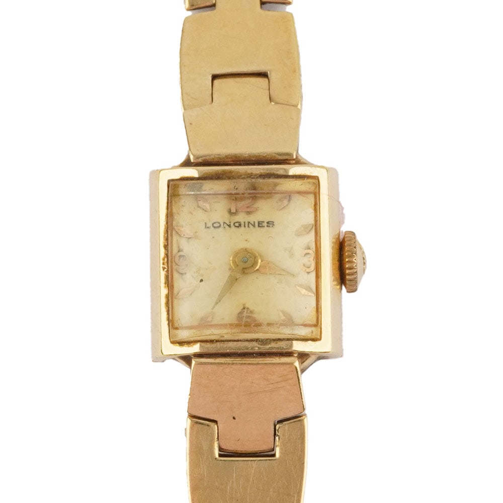 LONGINES: Description française: LONGINES Montre-bracelet Longines pour dame en or jaune 14K, boîtier de 1.4 x 1.4 cm, cadran champagne, index mixtes appliqués pour les heures, mouvement