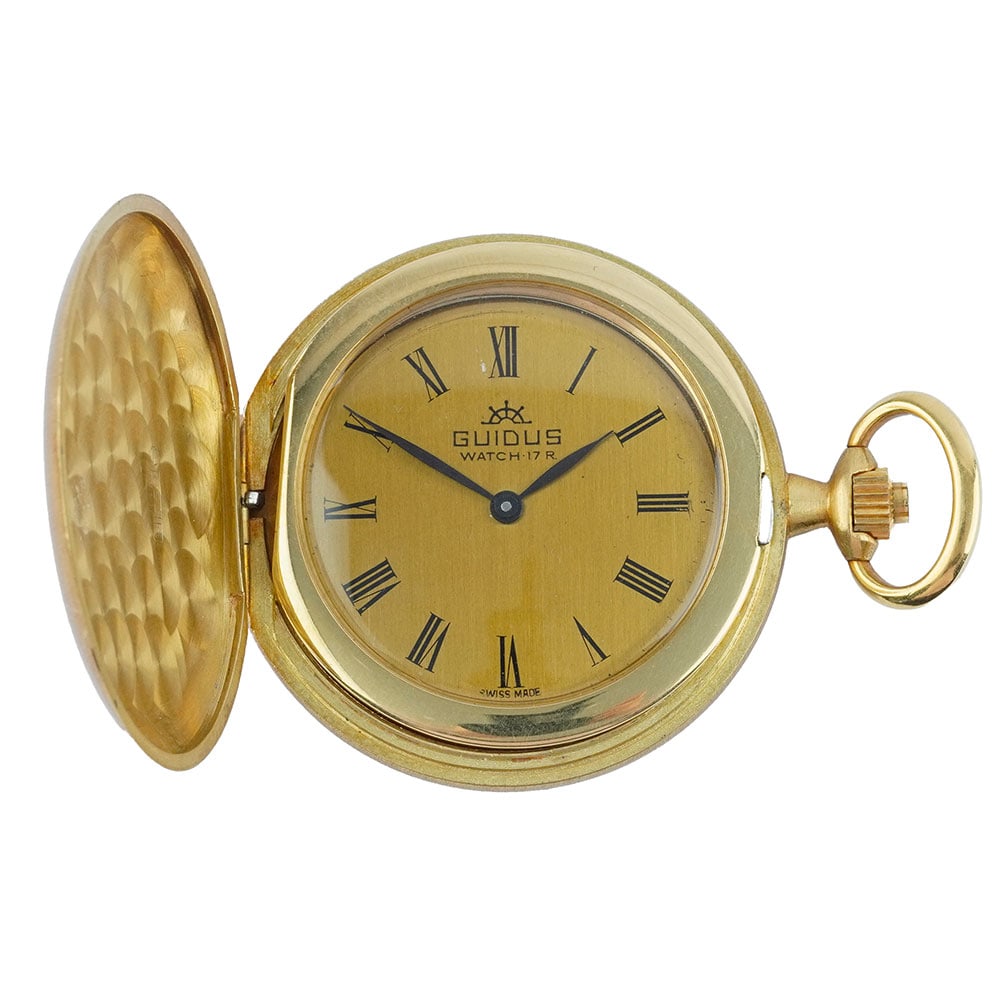 GUIDUS: Description française: GUIDUS Montre à gousset Guidus en or 18K, boîtier de 41 mm, cadran doré, chiffres romains appliqués pour les heures, mouvement mécanique à
