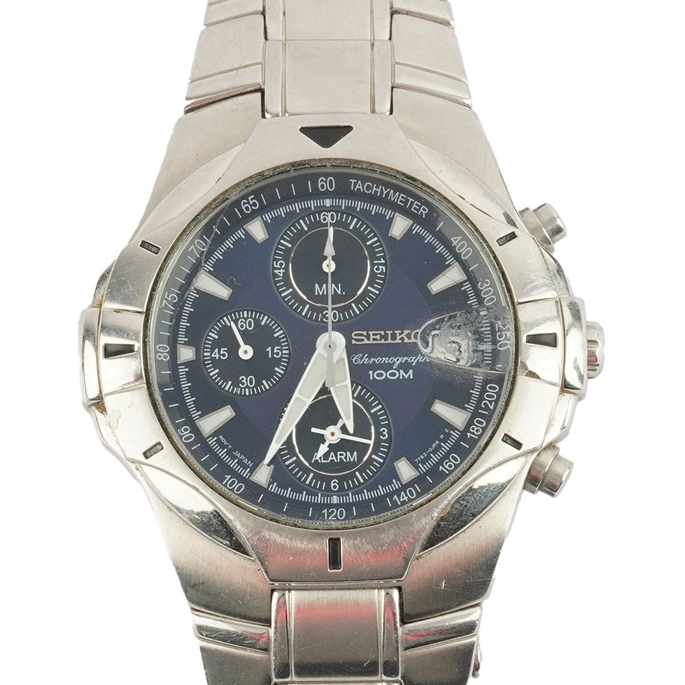 SEIKO: Description française: SEIKO Montre Seiko Chronographe 100m, boîtier en acier de , cadran bleu marine, date à 3h, mouvement quartz Seiko Réf: 7T62-0GF0 English Description: SEIKO