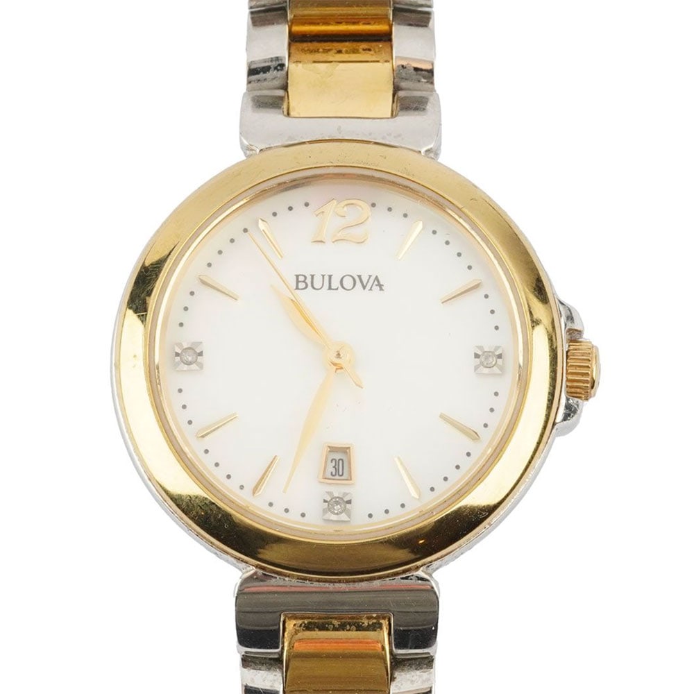 BULOVA: Description française: BULOVA Montre Bulova en acier 2 tons, boîtier rond de 30 mm environ, cadran nacré, index mixtes appliqués pour les heures, résistant à l'eau,
