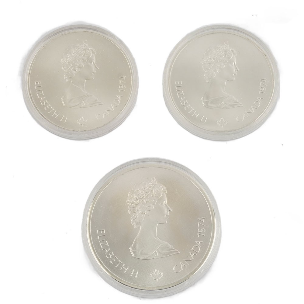 MONNAIES OLYMPIQUES / SILVER 0.925: Description française: MONNAIES OLYMPIQUES 1974 / SILVER 0.925 Ensemble de 3 pièces commémoratives de 1974 émises pour les Jeux olympiques de 1976 : - une pièce de 10 $,