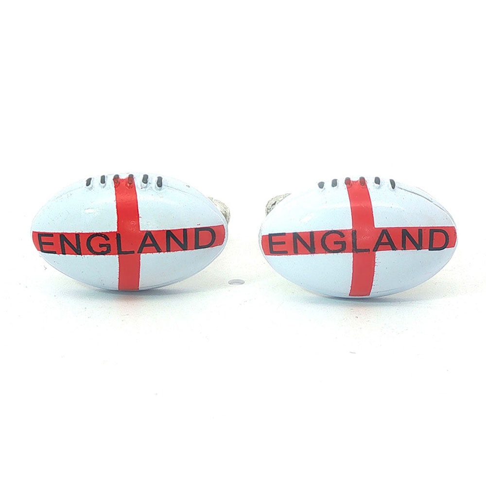 BOUTONS DE MANCHETTE/ CUFFLINKS: Description française: BOUTONS DE MANCHETTE Boutons de manchette représentant des ballons blanc de rugby en métal argenté English Description: CUFFLINKS Cufflinks depicting white