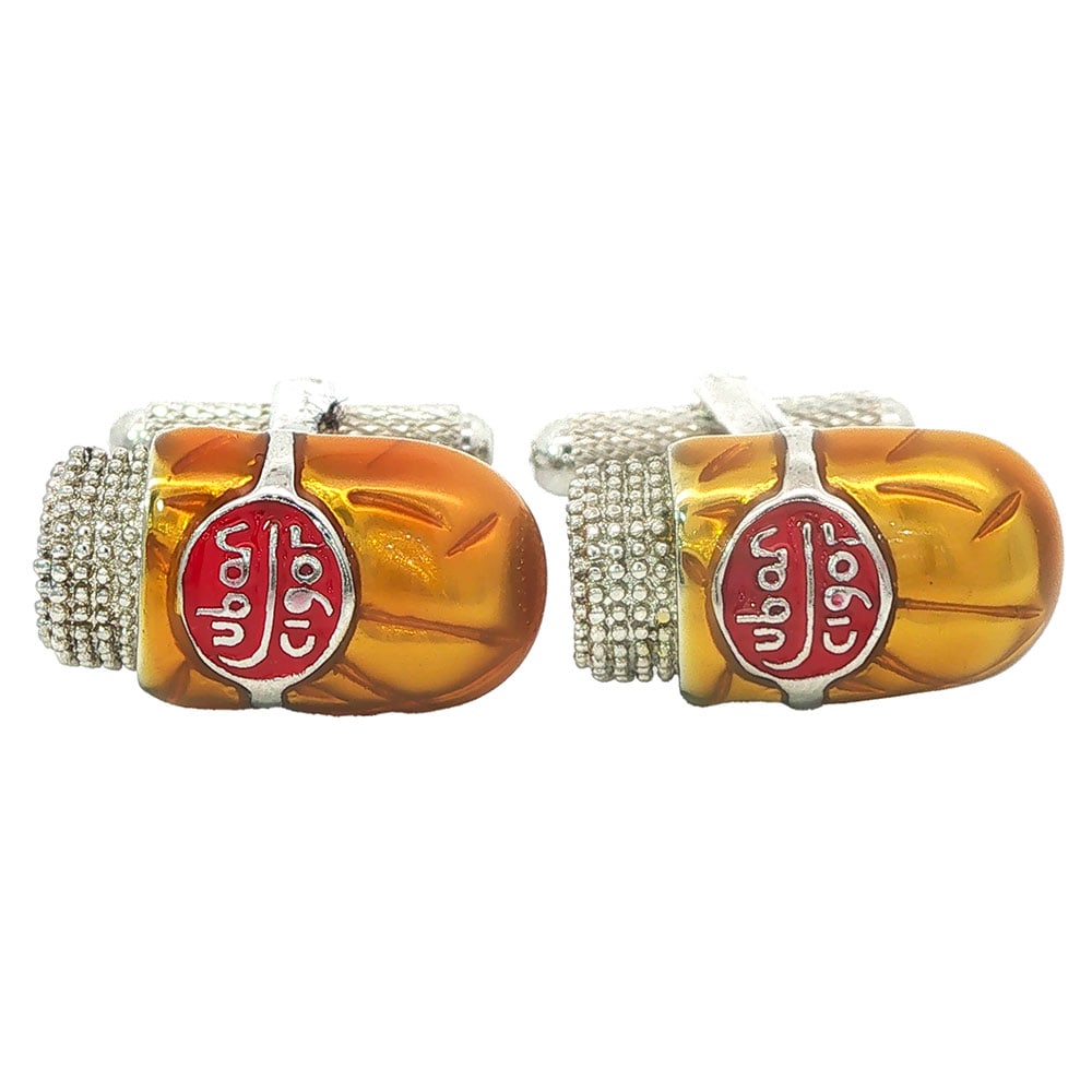 BOUTONS DE MANCHETTE/ CUFFLINKS: Description française: BOUTONS DE MANCHETTE Boutons de manchette en métal avec accents jaunes et rouges. English Description: CUFFLINKS Metal cufflinks with red and yellow accents.