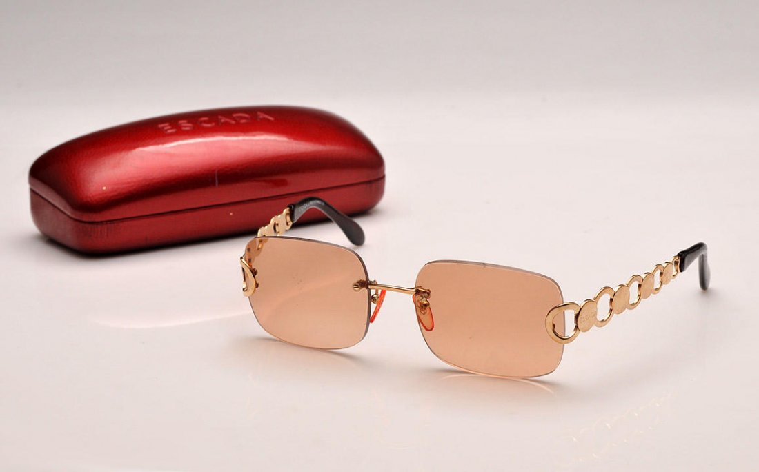 ESCADA: Smoked eye glasses. Signed “Escada”. With their case.