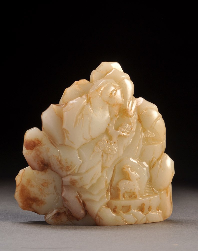 CHINA - Strong stones: CHINA - Strong stones White nephrite carved Rock decorated with a scholar and a servant under a pine tree and deer. H. 11cm – 4.25’’ E. 1500 / 2000
