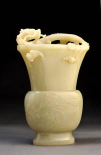 CLEAR CELADON NEPHRITIS "GU" VASE: CLEAR CELADON NEPHRITIS "GU" VASE WITH CARVED FLOWERS DECOR THE NECK DECORATED IN HIGH RELIEF WITH DETACHED DRAGON. CHINA. H. 20cm – 8’’ E : 5000 / 6000