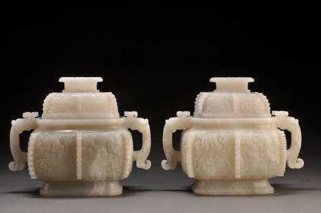 CHINA – HARD-STONES: CHINA – HARD-STONES Pair of white nephritis incense burners decorated with a mask of chimera relief. The shoulder is decorated with two chimera head shaped carved handles. H. 16 cm – 6.25’’ 