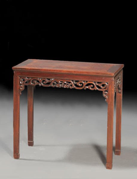 CHINA: A "recessed-leg" ALTAR TABLE, the apron carved with an openwork design of branches and peaches. China, Qing Dynasty. H: 87cm - 34.25'' L: 92cm - 36.25'' p-d: 47cm - 18.25''