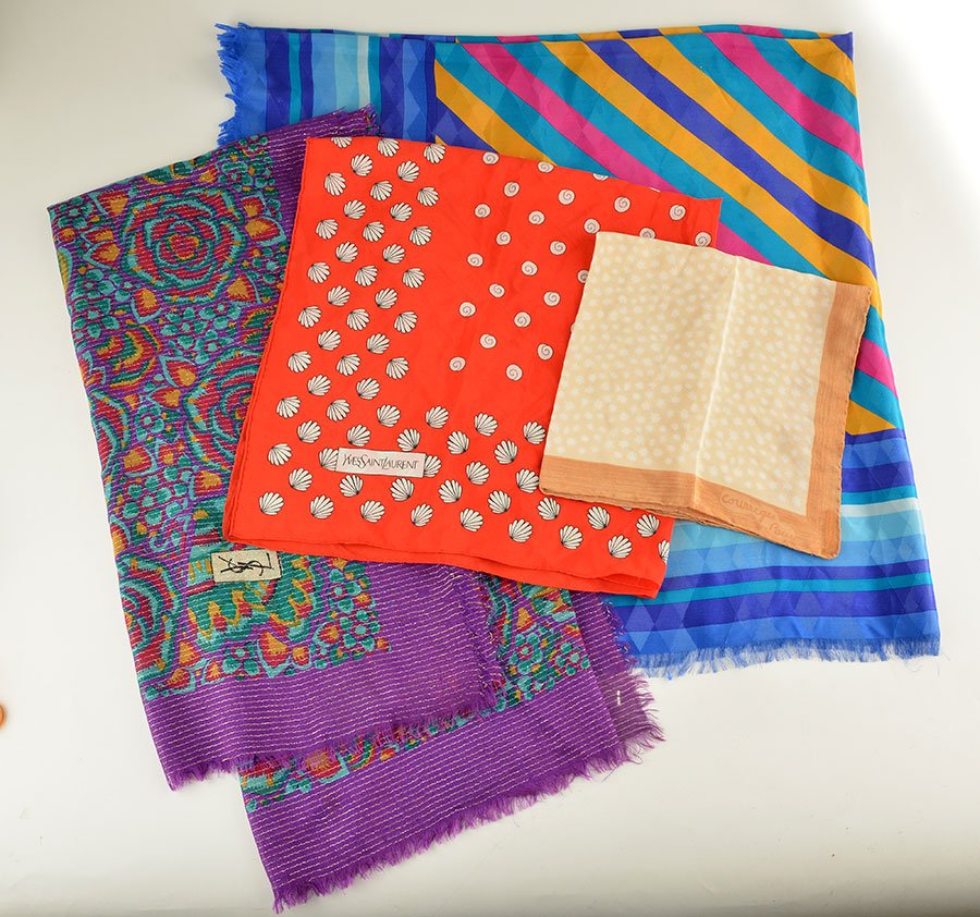 YVES SAINT LAURENT, COURRÈGES: Lot comprising 3 Yves Saint Laurent scarves and 1 Courrèges scarf.