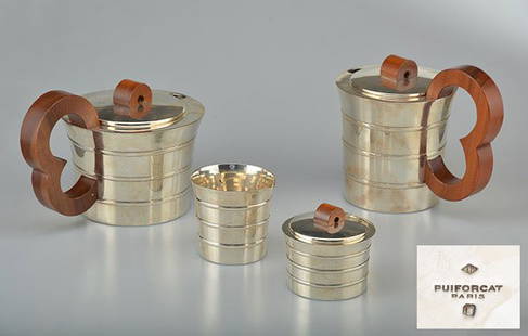 DECORATIVE ART OF 19th CENTURY : PUIFORCAT: 4 pieces Hallmarked silver the and coffee set "égoïste" with three rings. Fruit wood poly-lobed handle. Minerva hallmark. Circa 1936. Silversmith: Jean E. PUIFORCAT. H : 12cm - 4.75" D : 12cm - 4.75