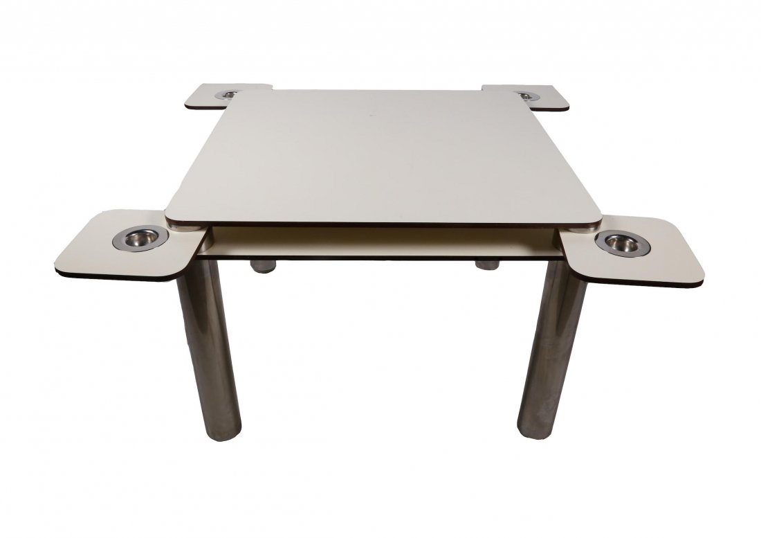 COLOMBO, Joe (1930-1971) for ZANOTTA (1954-): COLOMBO, Joe (1930-1971) for ZANOTTA (1954-)Laminated plastic laminate game table with two trays, four corners with small removable trays. Stainless steel cylindrical-shape feet. Inscriptions on each