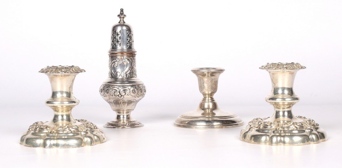 SILVER PLATE: Set of two silver plate candlestick with sculpted flower and volute decor. We also include : - An openworked silver plate censer with chiseled flower, volute and cross decor. - A silver plate ca