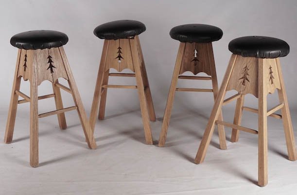 WOOD: Set of four carved wood stools and vinyl seat.