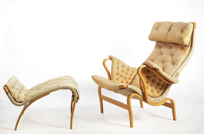 MATHSSON, Bruno (1907-1988): MATHSSON, Bruno (1907-1988) "Pernilla" birch armchair and ottoman, upholstered with beige leather. DUX Edition, Sweden Armchair: 96.5x84x82.5cm - 38x33x32.5"