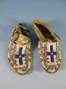 Sioux Hard Soled Beaded Moccasins: Sioux Hard Soled Beaded Moccasins. length: 9 1/4 inches. Damages in leather and bead work.