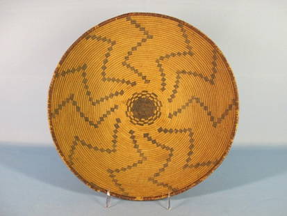 Southwest Coiled Basketry Tray, Apache, c. 1900: Large apache (Arizona Southwest) polychrome basketry tray, circa 1900, Classic coiled tray form (willow, red bud, and devil's claw) with a self-finishing red bud rim, dark center start with radiating