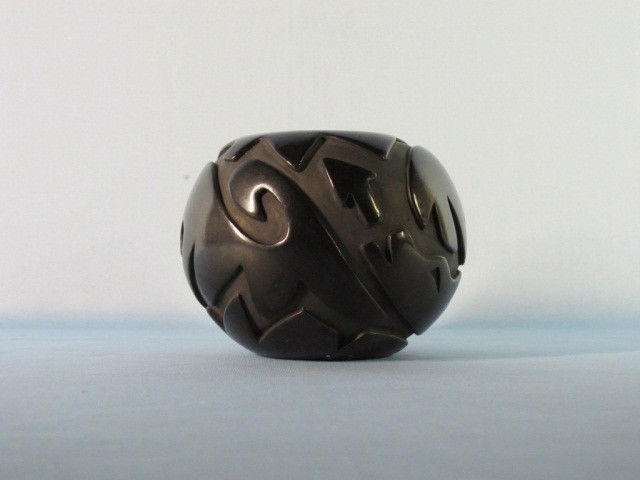 Santa Clara Pueblo Bowl by Joy Cain: Native American black ware carved and polished bowl signed on the foot Joy Cain (American ). Size D 6" x H 4 1/2"