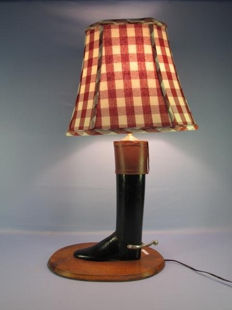 Decorative Carved & Painted Riding Boot Lamp: Decorative Carved & Painted Riding Boot Lamp, 20th C., constructed from a vintage boot last with leather trim & metal spur, stained pine base & brass hardware, includes plaid fabric shade, adjustable 